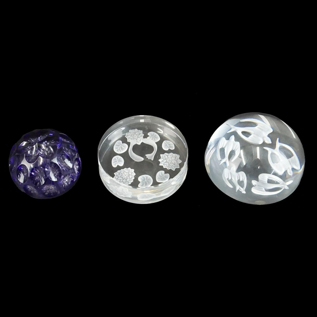 Paperweights: Cristal France Etched Crystal Paperweight, Sevres Etched Crystal Paperweight, and a Thomas Webb Faceted Cobalt Blue Paperweight. Each signed on the reverse side. Largest measures 2-1/4" x 4-1/8". Thom