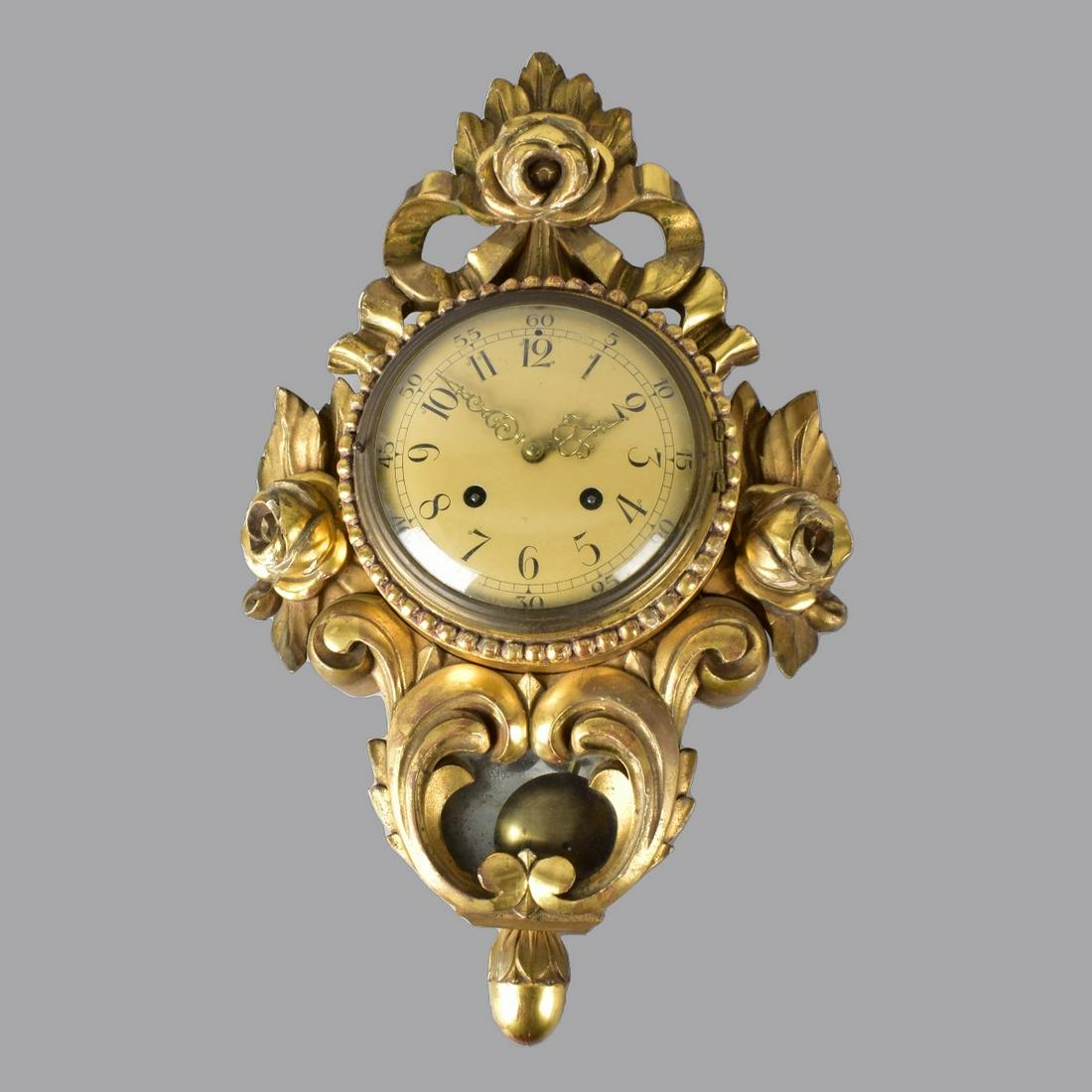 A.B. Westerstrand & Soner Swedish Cartel Clock: A.B. Westerstrand & Soner Swedish Gilt Carved Wood Cartel Clock. Marked on the movement. Key to accompany the lot. Overall measures 21" x 13" x 5-1/2". The Gallery does not guarantee the working condi