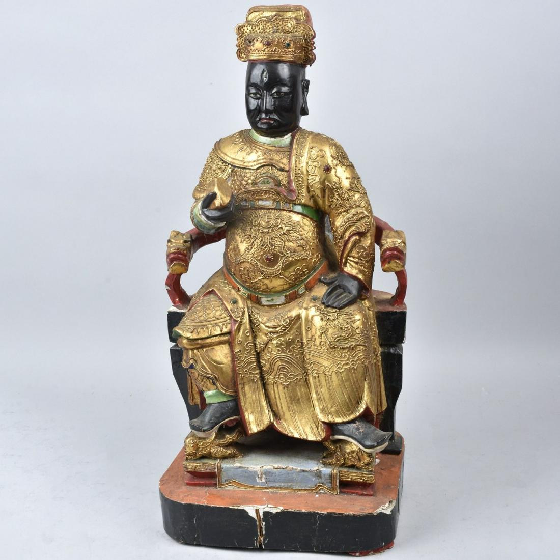 Chinese Seated Emperor Carved Temple Figure: Chinese Carved, Polychrome and Gilt Wood Seated Emperor Temple Figure on Lacquer Throne. Unsigned. Measures 19" H, 8-3/4" W. Estimate: $600.00 - $1200.00 Domestic Shipping: $125.00 Condition: Good con