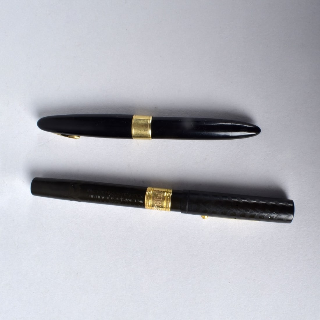Two Fountain Pens with 14K Nibs: Grouping of Two Fountain Pens with 14 Karat Gold Nibs. Includes a Waterman's Ideal together with a Sheaffer's Lifetime. Each stamped 14k with makers mark on the nib. Marked on the surface of the pens.