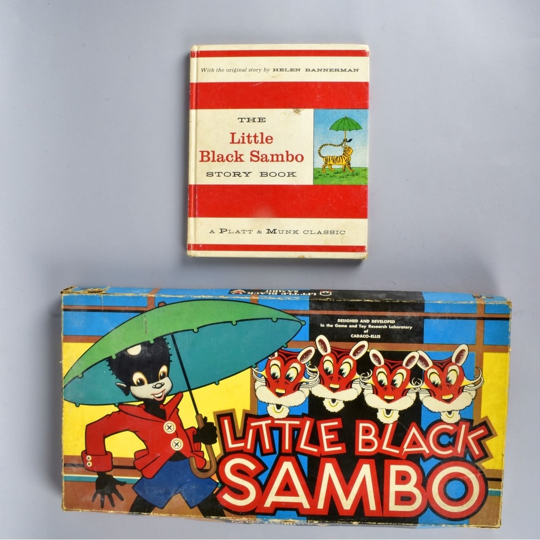 Black Americana Little Black Sambo Game and Book: Black Americana Little Black Sambo Game and Book.. Two Black Sambo Game Boards With two spinning cards and Seven Red Tokens and 4 Yellow Tokens with 4 plastic tokens. Marked Cadaco-Ellis 1951. Game Bo