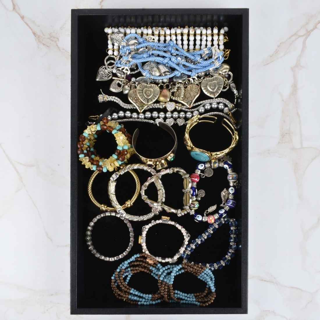 Collection of Fashion Bracelets: Collection of Nineteen Vintage Fashion Bracelets. Variously accented with faux diamonds, faux gemstones, beads, enamel and more. Various styles and makers. Condition: Good vintage condition. Estimate: