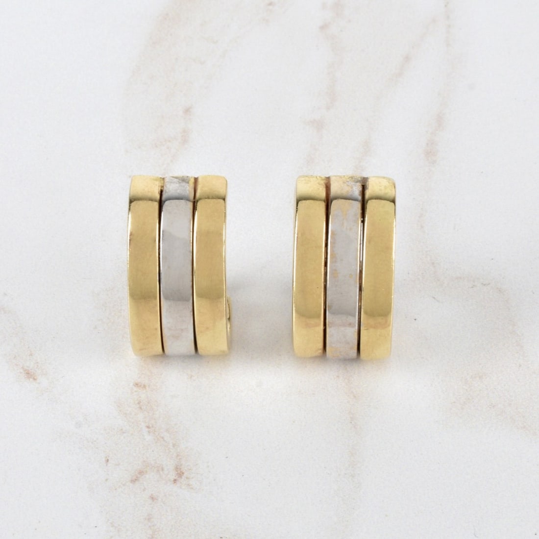 14K Earrings: Vintage Italian 14 Karat Yellow and White Gold Huggie Earrings. Stamped 14K. Measure 13/16" L, 1/2" W. Approx. total weight: 9.35 grams. Condition: Good vintage condition. Need cleaning. Estimate: $40