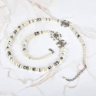 Chanel CC Necklace: Chanel CC Graduated Faux Pearl and Crystal Necklace. Pearls measures 5mm - 10mm. Measures 35-1/4". Provenance: The Orianne Collins Collection. A large portion of proceeds of this sale will be donated