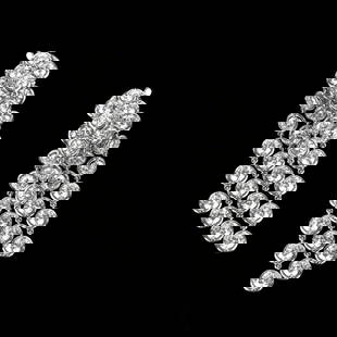 Van Cleef & Arpels Palmyre Diamond Earrings: Van Cleef & Arpels Palmyre Diamond and 18 Karat White Gold 4-Row Earrings. Set with 11.87 carat TW fifty-eight round brilliant cut diamonds, D color, VVS-VS clarity. Signed VCA, stamped Au750, numbere