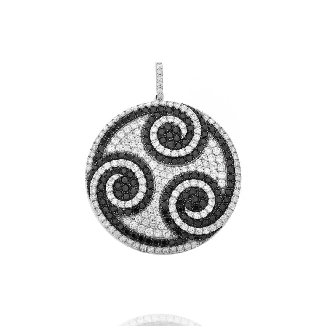 Diamond and 18K Pendant: Pave Set Round Brilliant Cut Black and White Diamond and 18 Karat White Gold Pendant. White diamonds D-E color, VS1 clarity. Stamped 18K 750. Measures 2" L, 1-5/8" W. Approx. weight: 16.05 grams. Cond