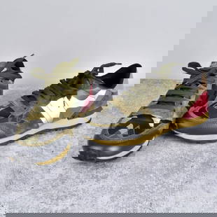 Valentino Garavani Rockrunner Sneakers: Valentino Garavani Mesh Fabric Camouflage Rockrunner Sneakers. Serial number: TJ912. Size: 38. Provenance: The Orianne Collins Collection. A large portion of proceeds of this sale will be donated to M