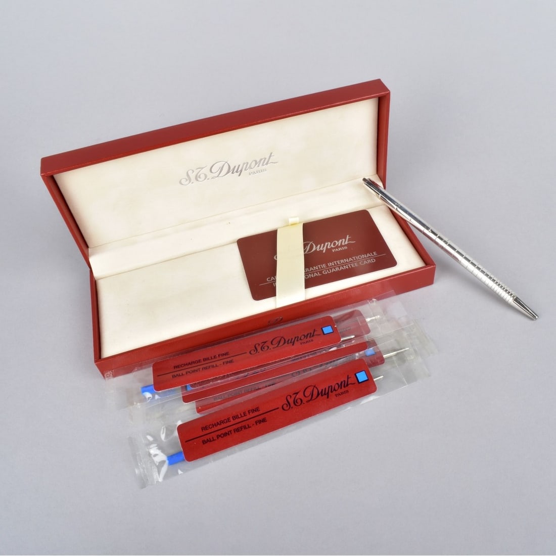 S.T. Dupont Silverplate Ballpoint Pen: S.T. Dupont Silverplate Ballpoint Pen. Design of circles getting smaller at to tip. Signed to middle S. T. Dupont Paris and logo. On pen clip marked Made in France 5J6GA20. Comes with Box, pen refills