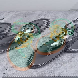 Dolce & Gabbana Sandals: Dolce & Gabbana Vero Cupop Sandals. Green leather straps with Green Crystal and Gold Flower Design. Size 38 Provenance: The Orianne Collins Collection. A large portion of proceeds of this sale will be