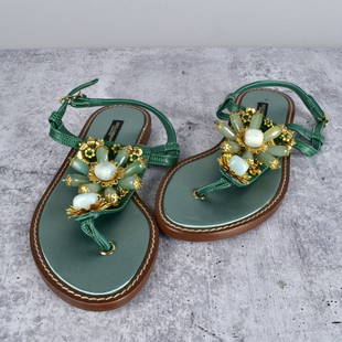 Dolce & Gabbana Sandals: Dolce & Gabbana Vero Cupop Sandals. Green leather straps with Green Crystal and Gold Flower Design. Size 38 Provenance: The Orianne Collins Collection. A large portion of proceeds of this sale will be