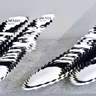 Prada Pointy Toe Black High Top Sneakers: Prada White Pointy Toe Black High Top Sneakers. Serial number 1T615M. Size womans 38-1/2.Provenance: The Orianne Collins Collection. A large portion of proceeds of this sale will be donated to Ms Coll