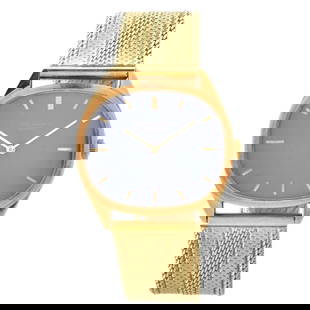Patek Philippe Ellipse 18K Watch: Man's Vintage Patek Philippe Ellipse 18 Karat Yellow Gold Watch, Blue Dial, Manual Wind Movement. Later added 14 karat yellow gold bracelet. Case measures 27 x 32mm; bracelet measures 6-5/8" L. Approx