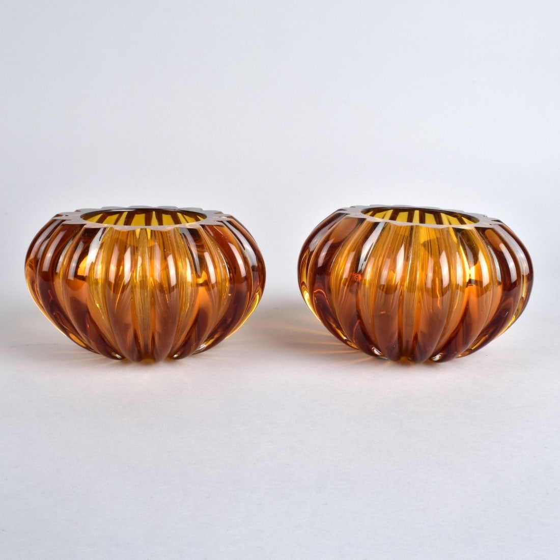 Pair of Murano for Fendi Votive: Pair of Murano for Fendi Amber Glass Votive. Signed and original labels on the surface. Measures 3-1/4" x 5-1/4". Provenance: The Orianne Collins Collection. A large portion of proceeds of this sale w