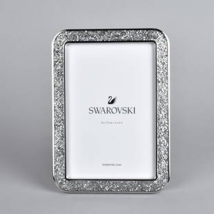 Pr Swarovski Minera Picture Frames: Pair Swarovski Minera Picture Frames surrounded by Swarovski Crystals, in original boxes with paperwork. .Measure 7"L x 5"W. Provenance: The Orianne Collins Collection. A large portion of proceeds of