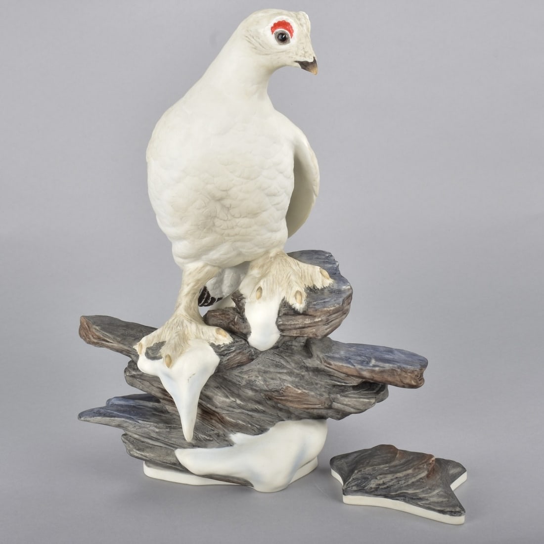 Boehm Porcelain Ptarmigan with Rock Mold: Boehm Porcelain Male Ptarmigan Bird Figurine With Rock Mold, Standing in snow, Limited Edition. Signed approperately Bottoms marked 463. Measures 13-1/2"H x 10-1/4"L 8"W Condition: Good Condition Esti