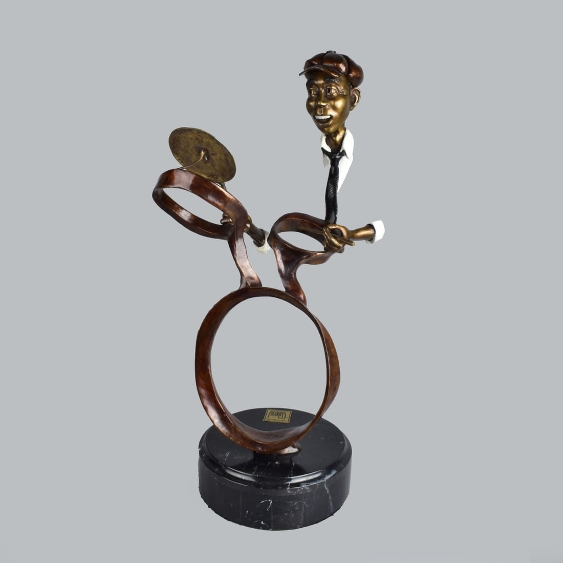 Carlos Aguilar y Linares, Mexican (1945 - 2010): Carlos Aguilar y Linares, Mexican (1945 - 2010) Bronze Sculpture Presented on a Marble Base "Drummer" Signed and Numbered 3/75. Overall measures 24-1/2" x 10" x 9". Provenance: The Orianne Collins Col