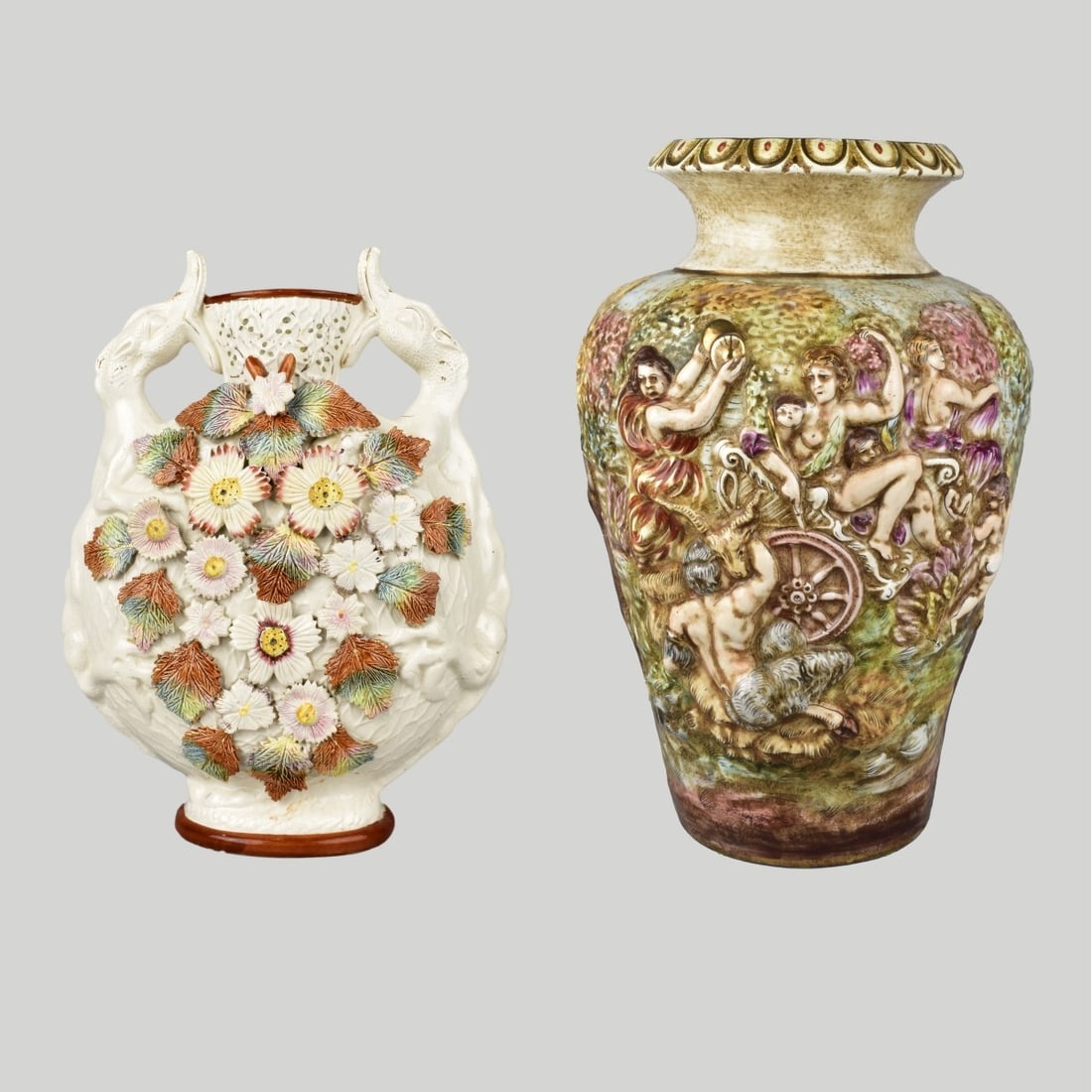 Capodimonte and Majolica Vases: Two Vases Consisting of a English Barbotine Majolica Vase signed to bottom England 547, Measures 13" x 19-1/2" x 3-1/2. Along with a Capodimonte Hand painted Vase with putti, nudes, dancing and goats.