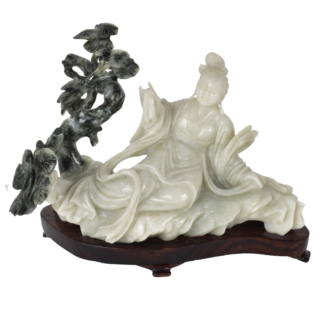 Chinese Jade Woman: Chinese Black and White Jade Recumbent Woman finely carved Sculpture, on fitted footed wooden base. unsigned. Figure Measures 4-1/2" H x 7-1/2" W x 3-1/2" D w/o base. Base 3/4" H. Condition: Good cond