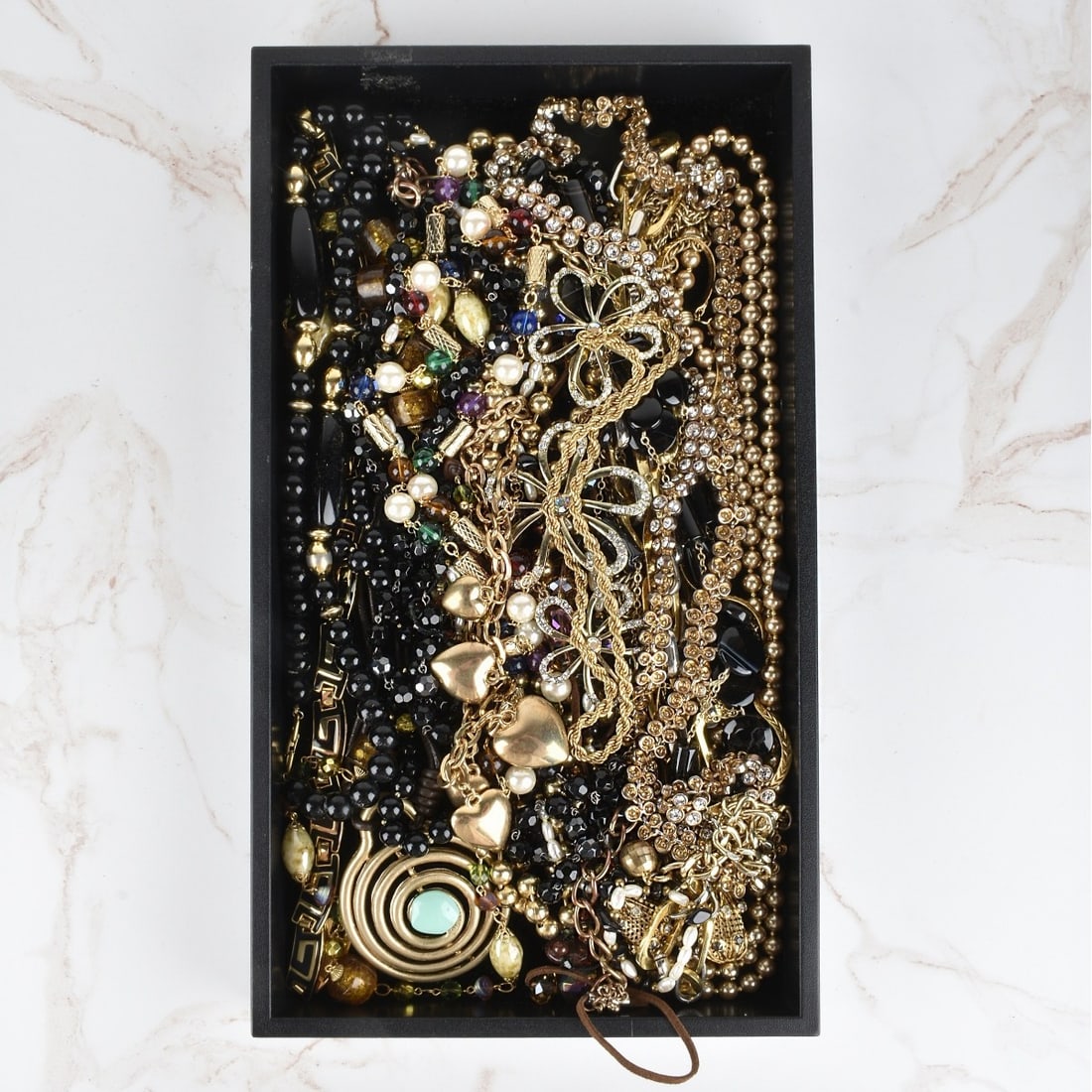 Collection of Fashion Necklaces: Collection of Vintage Gold Tone Metal Necklaces. Variously accented with beads, faux amber, baroque pearls and more. Various styles and makers. Condition: Good vintage condition. Estimate: $40.00 - $8
