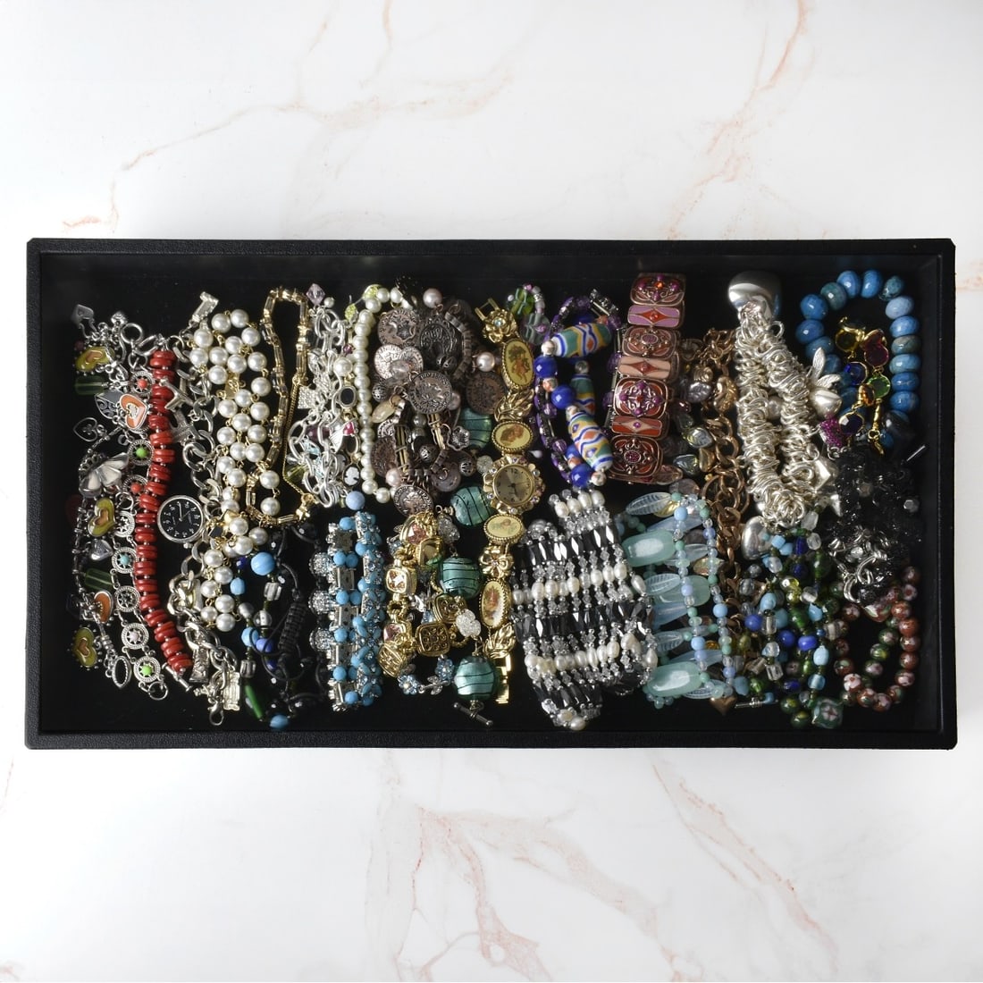 Collection of Fashion Bracelets: Collection of Vintage Fashion Bracelets and a Couple of Bracelet Watches. Variously accented with faux diamonds, faux gemstones, faux pearls, hardstones, enamel, beads and more. Various styles and mak