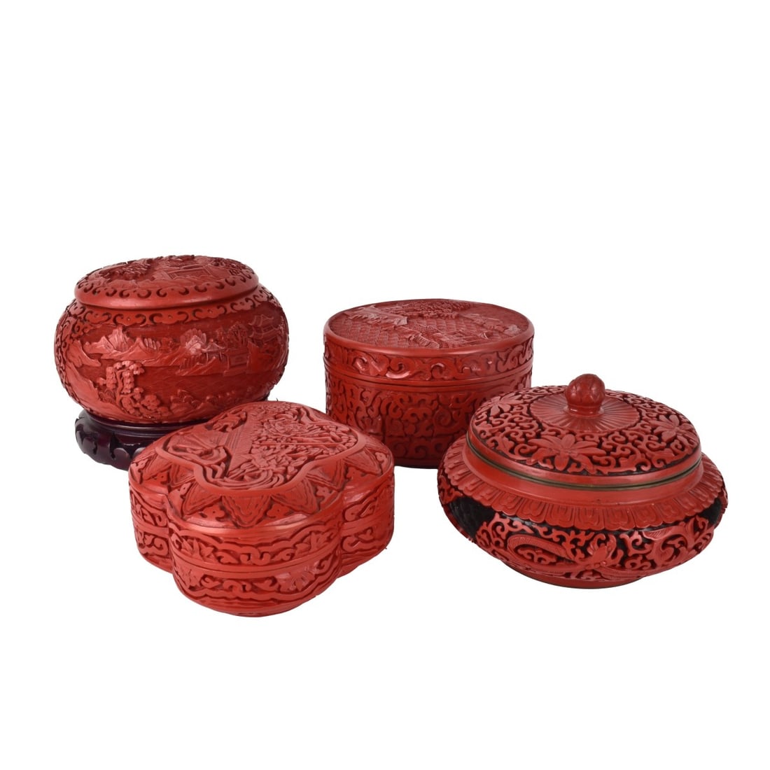 Four Cinnabar Boxes: Four (4) Cinnabar Boxes, one with base. Largest 3-1/2" H x 6-1/4" Diameter, w/o 1/2" base . Condition: Good condition, round flat one has some nicks to inner edge, round one with base has a chip to in