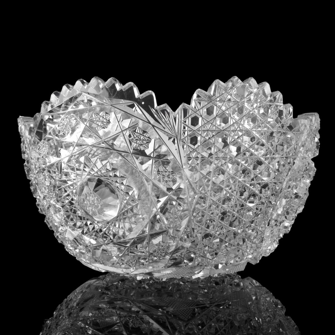 American Brilliant Cut Glass Bowl: American Brilliant Cut Glass Bowl,with knobs of Hobstars and Rose diamond cuts. Measures 4-5/8" H x 8-7/8" D. Condition: Good used Condition, some nicks to the rim. Estimate: $50.00 - $150.00 Domestic