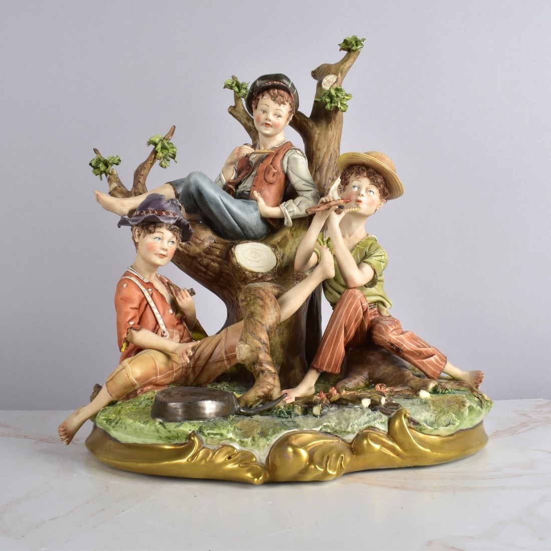 Large Capodimonte Porcelain Group: Large Capodimonte "Smoke with Friends" Porcelain Group by D. Bonalberti. Signed on the base. Measures 13" x 11" x 9-1/2". Please note we have not examined every piece in detail and make no warranty th