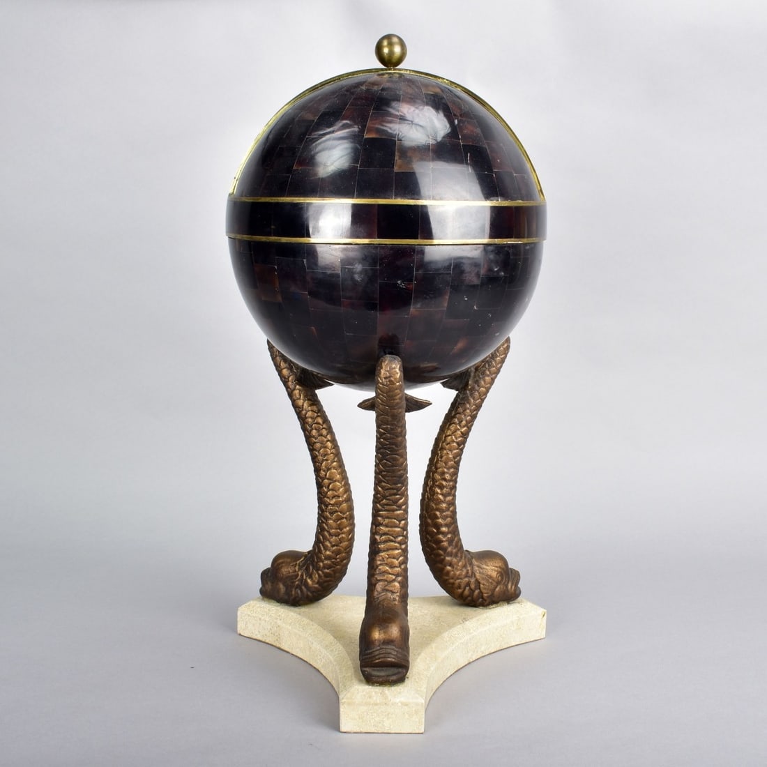 Maitland Smith Tessellated Globe Centerpiece: Large Vintage Maitland Smith Tessellated Globe Centerpiece with Metal Dolphin Supports. Overall measures 20-1/2" x 11". Condition: Good condition. Estimate: $150.00 - $300.00 Domestic Shipping: Third 