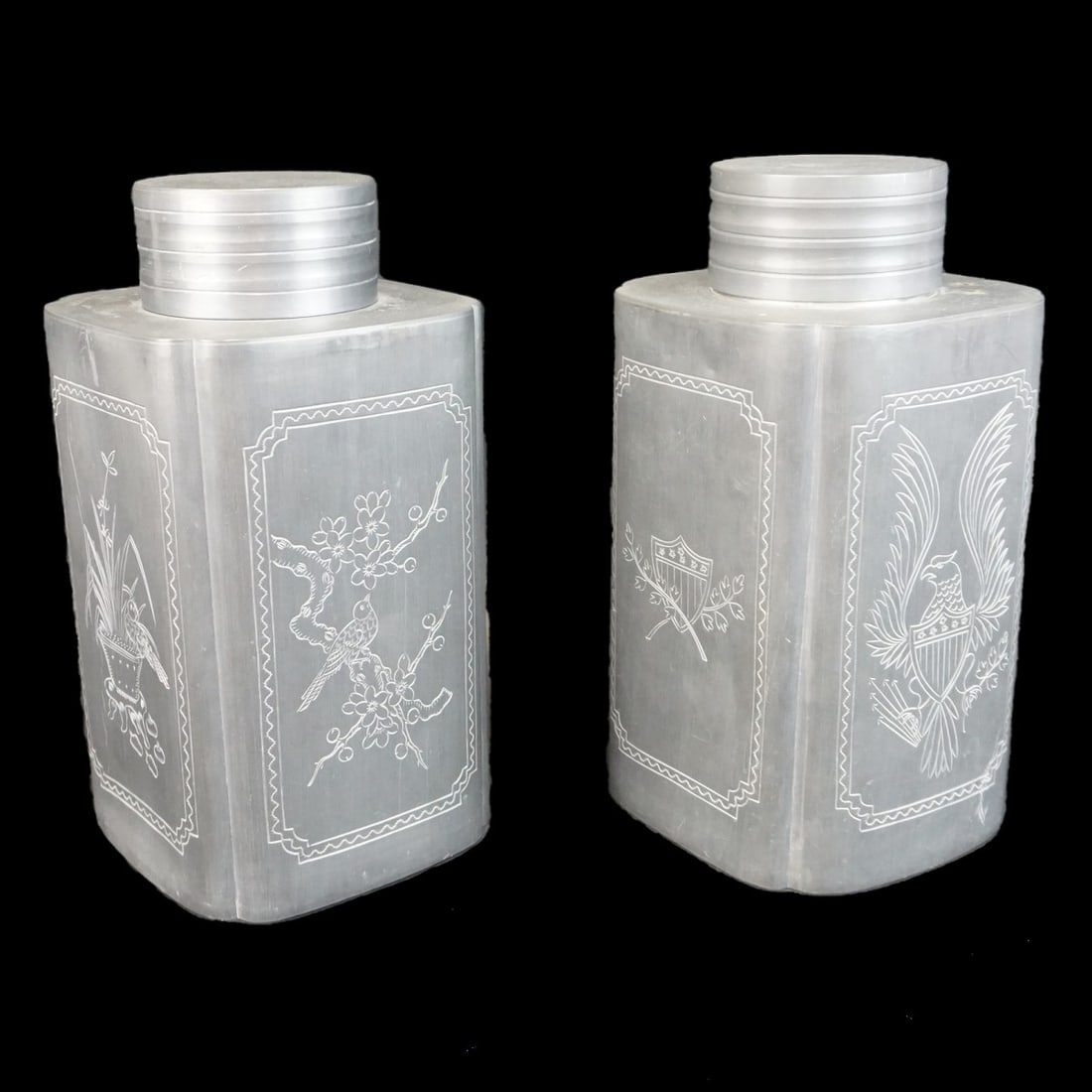 Pair of Chinese Canisters: Pair of Large Chinese Export Pewter Metal Canisters. Signed. Measures 12-1/2" x 6-1/2". Condition: Scuffs and rubbing to the surface otherwise good condition. Estimate: $50.00 - $150.00 Domestic Shipp