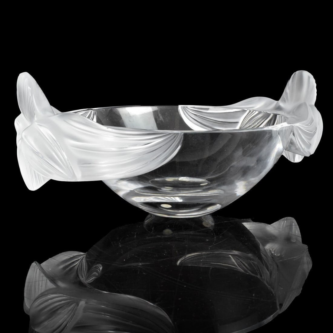 Lalique "Loriol" Crystal Bowl: Lalique "Loriol" Crystal Bowl with Frosted Handles. Signed Lalique France on the base. Measures 5-1/4" x 12-1/4" x 8-5/8". Condition: Very small chip on the base of one handle. Estimate: $300.00 - $50