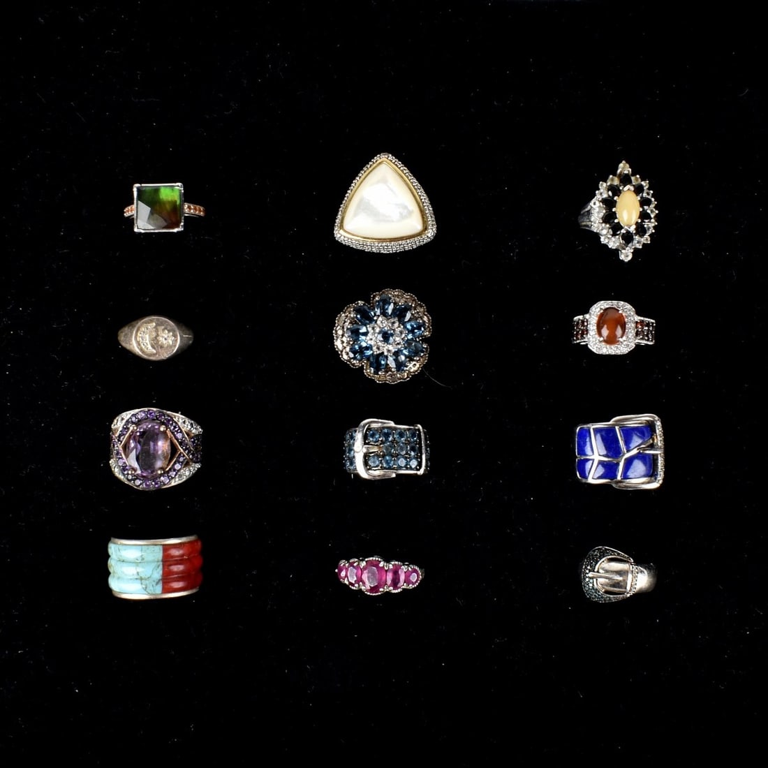 Fashion Jewelry Silver Rings: Collection of Twelve Fashion Jewelry Sterling Silver Rings. Variously accented with faux gemstones, faux diamonds, hardstones and more. Various sizes. Most stamped 925. Approx. total weight: 78.91 gra