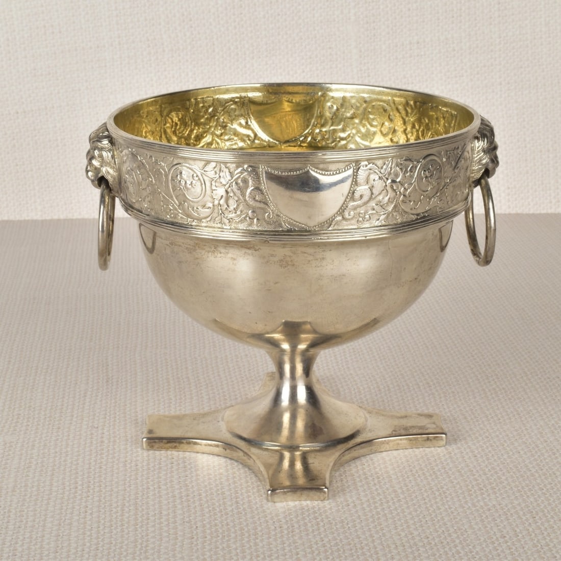 Antique Danish Silver Footed Bowl: Antique Danish Silver Footed Bowl with Attached Lion Mask Rings, Supported on a Four Footed Pedestal Base. Decorated with a floral band to top portion of the bowl. Stamped with assay mark, as well as 