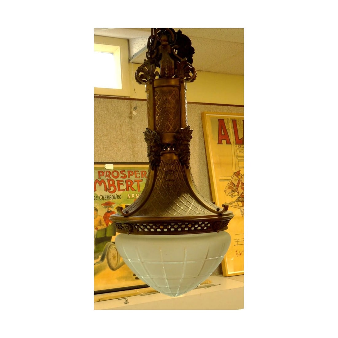 Early 20C Cast Metal and Glass Chandelier: Early 20th Century Cast Metal and Glass Chandelier. Nicely Done with Cast Metal Mask Faces and a Frosted Cut Glass Dome Shade. Measures 36 Inches Tall by 18 Inches Wide. Condition: Very Good Condition