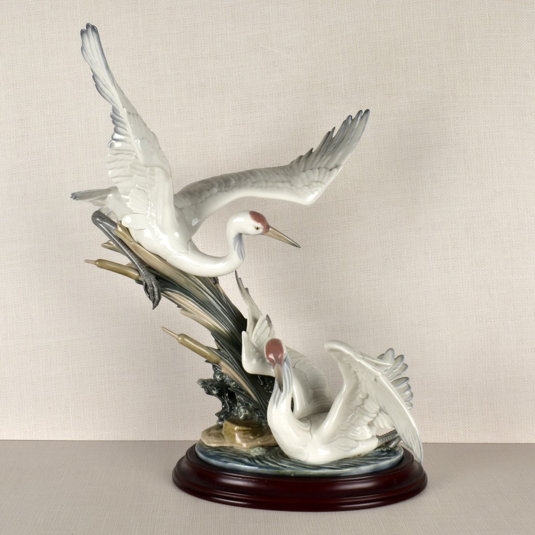 Lladro "Courting Cranes" Figurine: Lladro Porcelain Figurine "Courting Cranes". Incised number "1456" on the bottom, also marked "5" in pencil, This is a retired limited edition sculpture with original wooden base. Measures: 20-3/8" H,