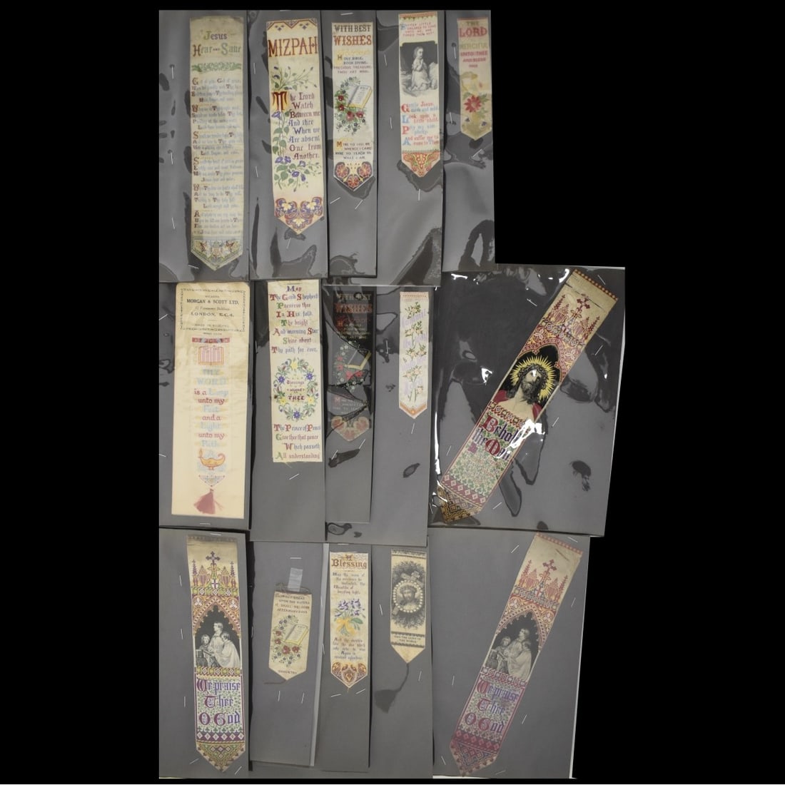 19C Embroidered Silk Bookmarks: Fifteen (15) 19th Century Embroidered Silk Christian Bookmarks. Bible, Jesus, Prayers, etc. All in 8-1/2 x 11 plastic sheets. largest 11-3/4" L smallest 3-3/4" L. Condition: Good used condition, some