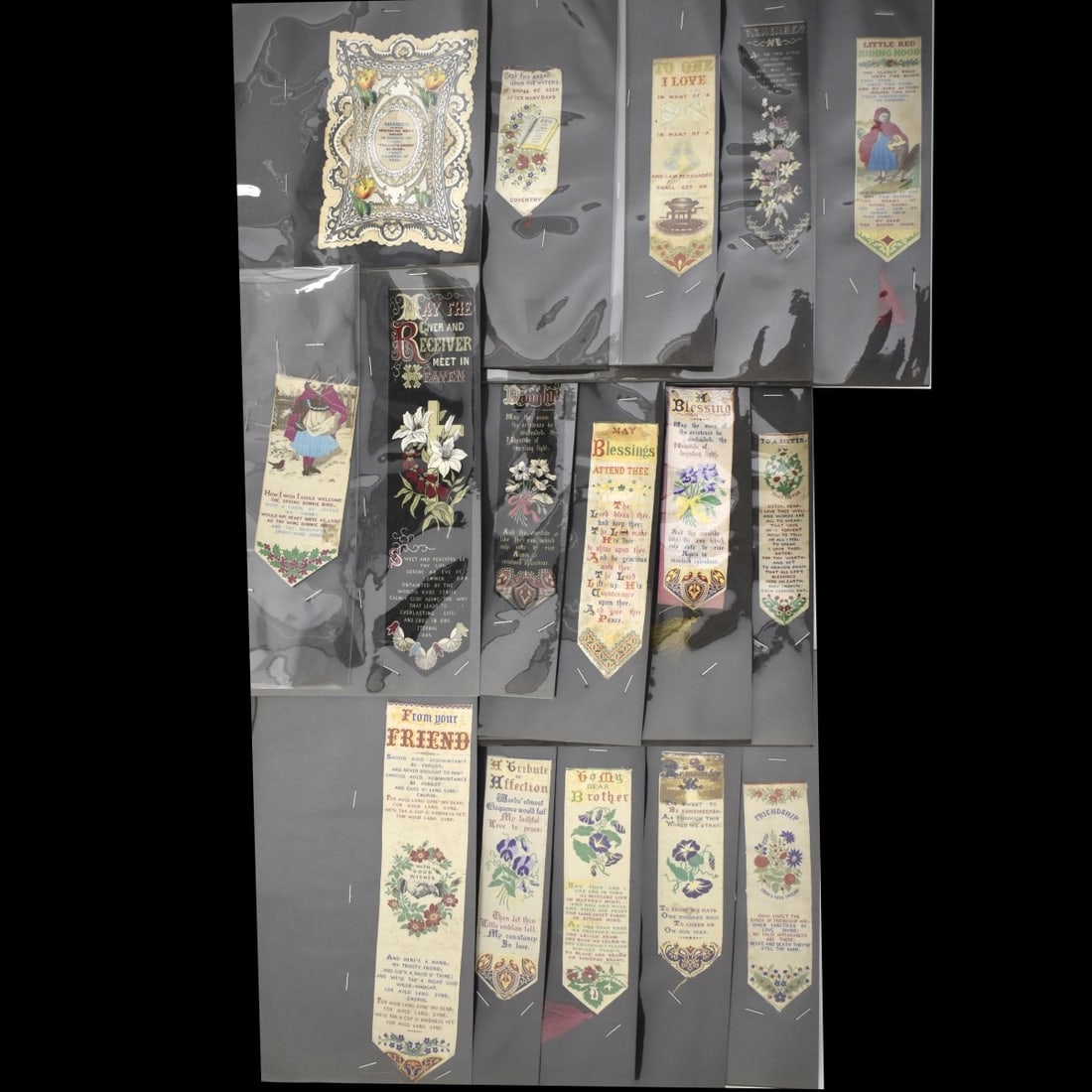 19C Embroidered Silk Bookmarks: Fifteen (15) 19th Century Embroidered Silk Bookmarks. Red riding hood, remember me, brother, daughter, sister, blessings,friend and Love etc . Along with a Memory card. All in 8-1/2 x 11 plastic sheet