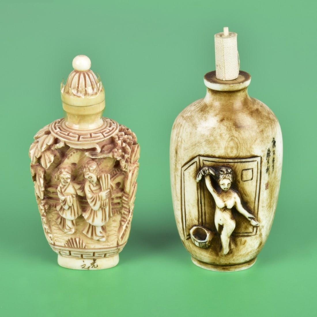 Two Antique Chinese Snuff Bottles: Grouping of Two Antique Chinese Carved Snuff Bottles. Lot includes a signed erotic nude relief bottle with a associated stopper and a deep relief carved bottle. Tallest measures 3" x 1-1/2". Smallest 