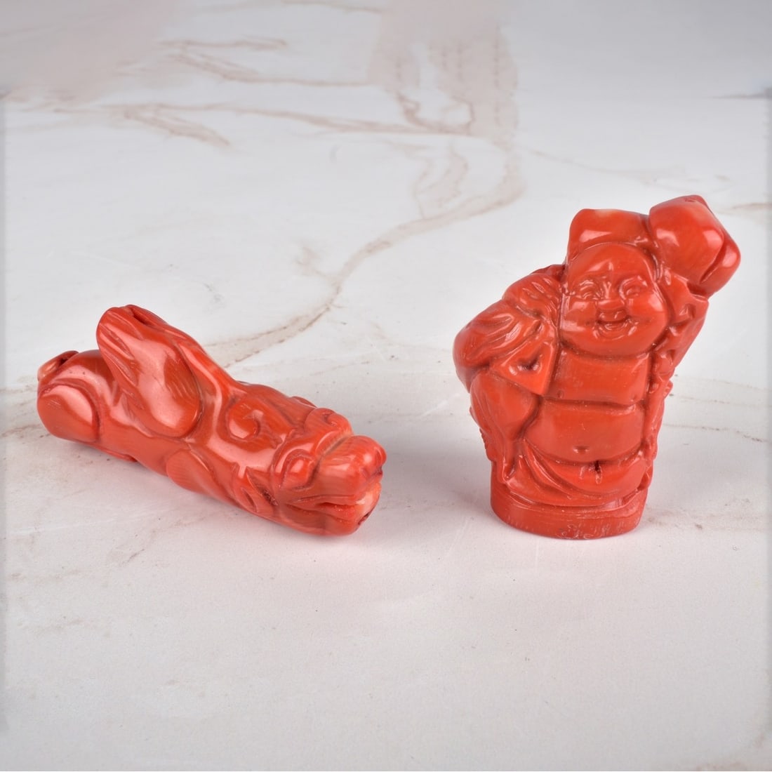 Antique Chinese Coral Figurines: Lot of Two Antique Chinese Red Coral Figurines. Longest measures 3". Smallest measures 2" x 1-3/4". Condition: Good condition. Estimate: $50.00 - $150.00 Domestic Shipping: $45.00