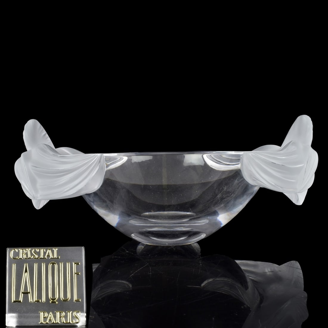 Lalique "Loriol" Bowl: Lalique "Loriol" Crystal Oval Bowl. A clear and frosty bowl decorated with large orchids at end end, Signed "Lalique France" in script on the bottom, 20th century. Measures: 5-1/2" H, 13-1/2" L, 8-1/2