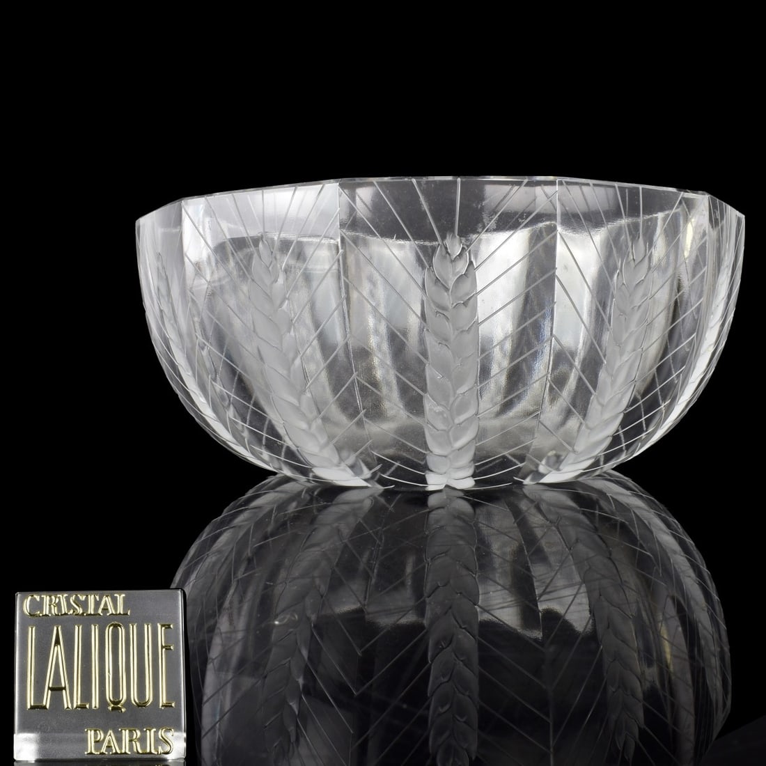 Lalique "Ceres" Bowl: Lalique "Ceres" Clear to Frosted Glass Lobed Bowl. Each panel decorated with a frosted barley wheat stalk. Marked "Lalique France" to the underside, late 20th century. Measures: 3-3/4" H, 8-1/2" D. Co