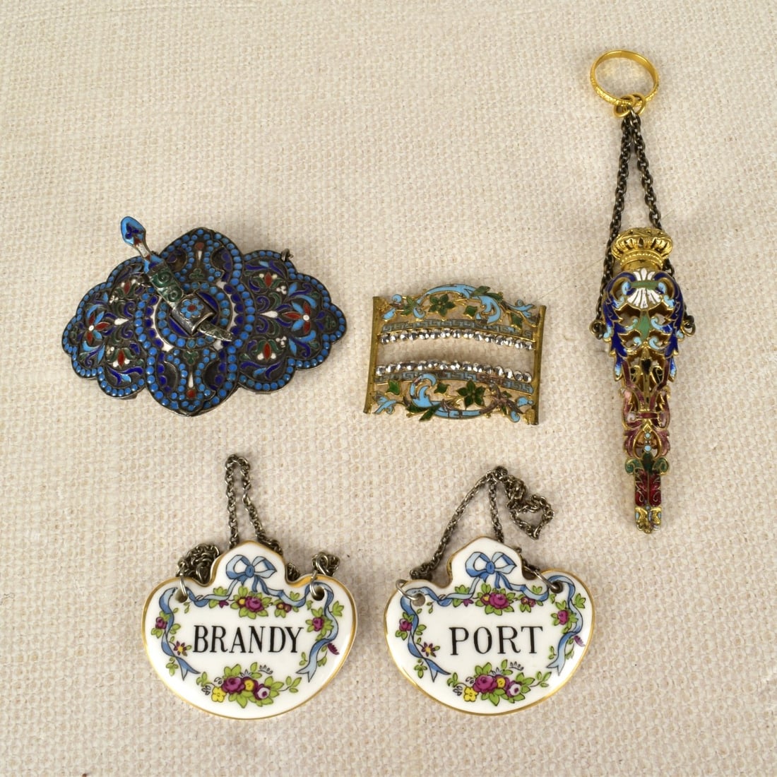 Antique Russian Champleve Articles: Antique Russian Champleve Articles Along with Two (2) Staffordshire English Bone China Decanter Markers with Chains. One (1) Scent bottle with no glass insert present, one (1) Champleve two (2) piece