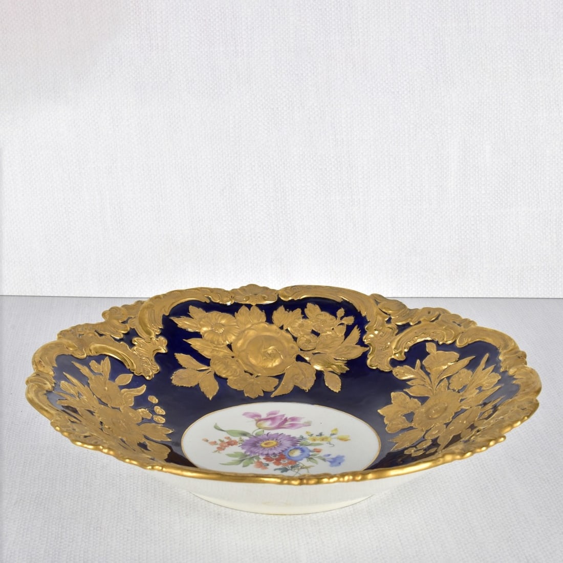 Antique Meissen Centerpiece Bowl: Antique Meissen Heavy Gold Gilded Centerpiece Bowl with a Central Medallion Decorated with a Spray of Flowers. Marked to the bottom with the Meissen crossed swords under glaze and impressed number "Z9