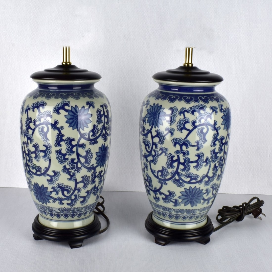 Pair of Porcelain Lamps: Modern Pair of Chinese Influenced Blue and White Porcelain Lamps. Measures" 15" H, 7" Dia. Condition: Good condition. Estimate: $50.00 - $100.00 Domestic Shipping: Third party.