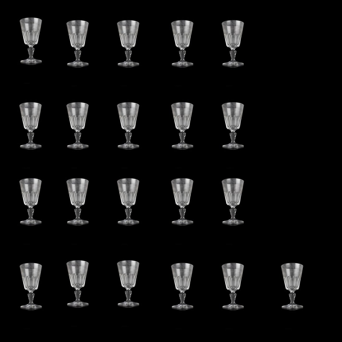 Vintage Baccarat "Bretagne" Crystal Glasses: Twenty One (21) Vintage Baccarat "Bretagne" Crystal Wine Glasses. Measures: 4-7/8" H, 2-1/2" Dia. Condition: Good condition, one (1) with a very small flea bite to top rim. Estimate: $250.00 - $400.00