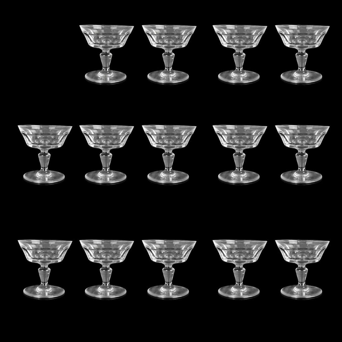 Vintage Baccarat "Bretagne" Crystal Glasses: Fourteen (14) Vintage Baccarat "Bretagne" Crystal Champagne or Tall Sherbet Glasses. Measures: 3-3/4" H, 4" Dia. Condition: Good condition. One glass with a small chip. Estimate: $250.00 - $400.00 Dom
