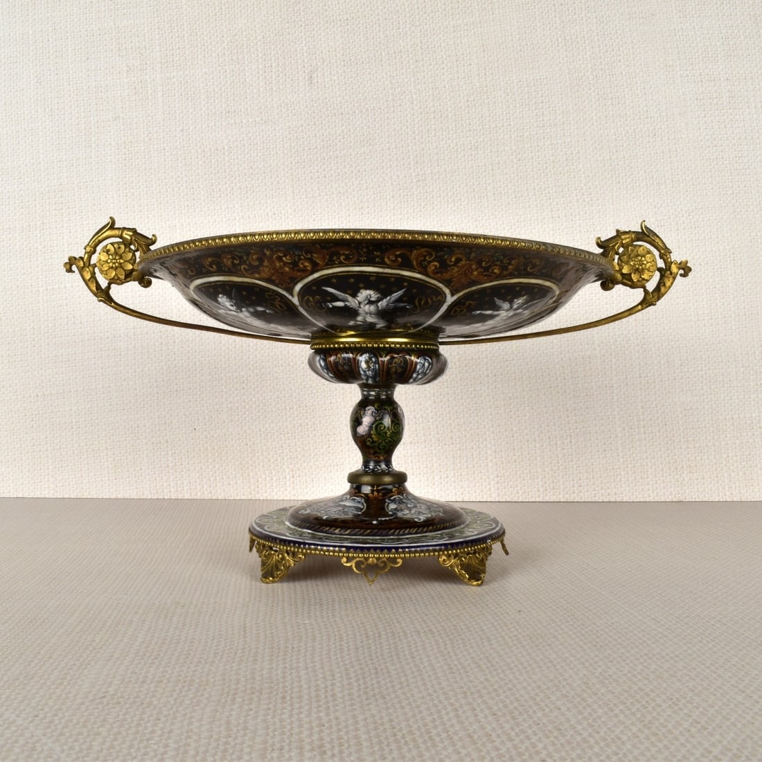 Limoges Iridescent Enameled Coup: 19th Century Limoges Iridescent Enameled Coupe on an Enameled Pedestal Base. Decorated Reserves with Deities in the Bowl and Nudes in the Reserves on the Footed Base Raised on Four Angular Foliate Fee