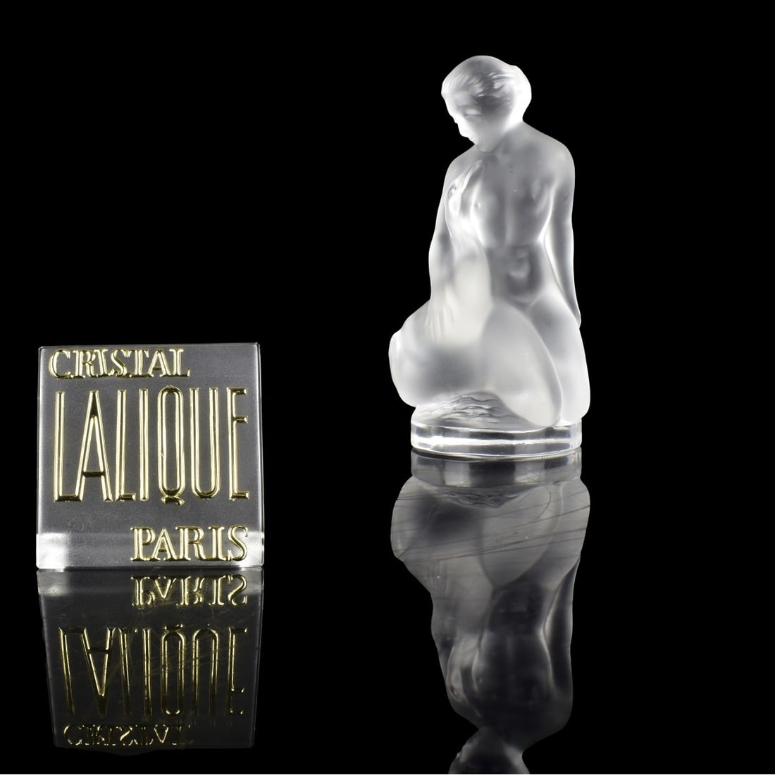 Lalique "Leda and the Swan" Figurine: Vintage Lalique "Leda and the Swan" Figurine in Clear and Frosty Glass, signed "Lalique France" on the bottom. Measures: 4-1/2" H, 2" D. Condition: Good condition. Estimate: $100.00 - $150.00 Domestic