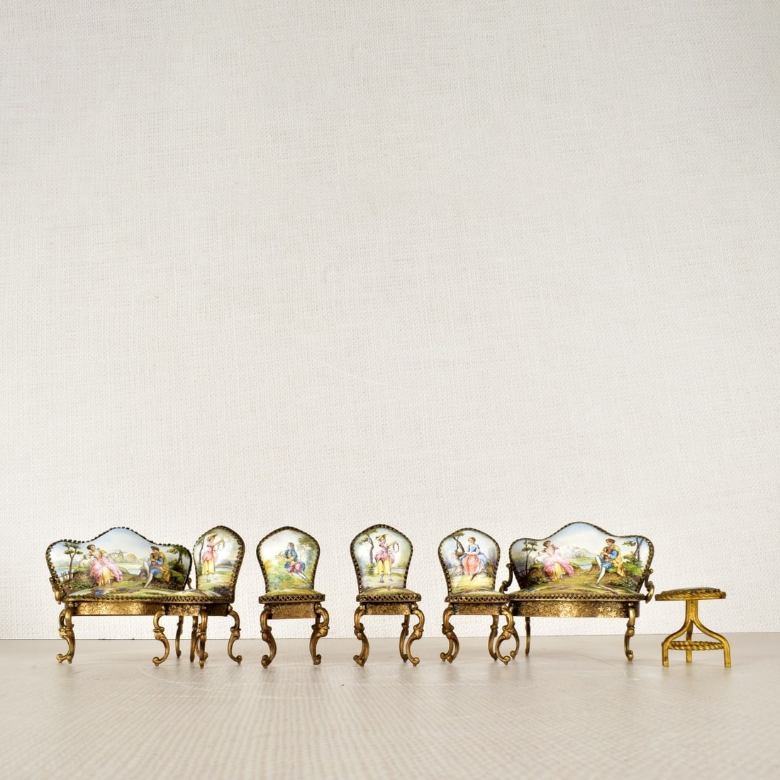 Austrian Miniature Painted Enamel Furniture: Austrian Miniature Painted Enamel Furniture. Consisting of two (2) settees and four (4) chairs and one (1) round stool.19th century. Settee measures: 2-1/2" H, 3-1/4" W, 1-1/2" D. Condition: Good cond