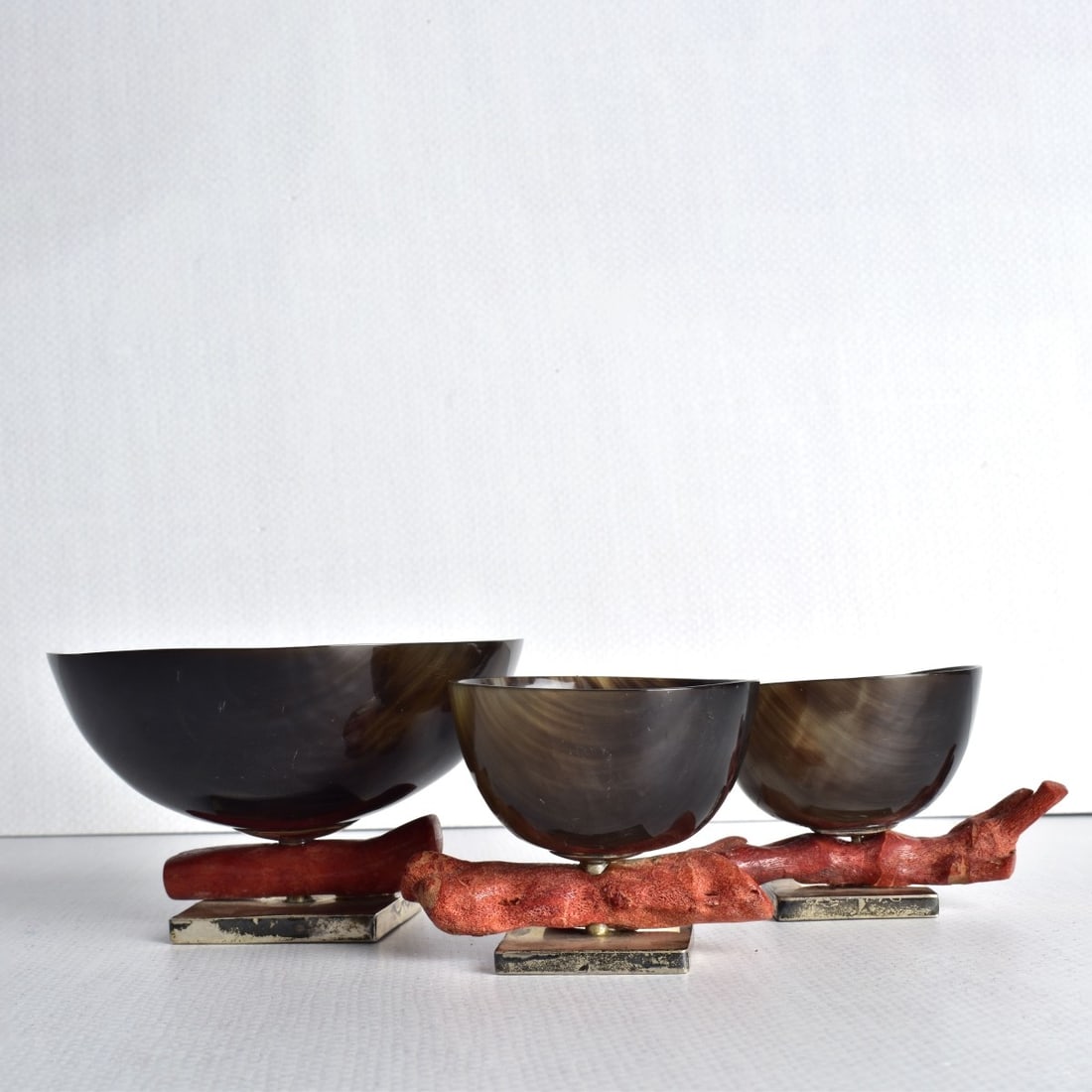 Horn and Coral Bowls: Three (3) Pieces Horn and Coral Bowls with 0.925 Sterling Silver Bases. Bottom stamped with makers logo as well as stamped (925). Tallest measures: 3-3/4" H, 4-3/8" Dia., smallest measures: 2-1/4" H, 