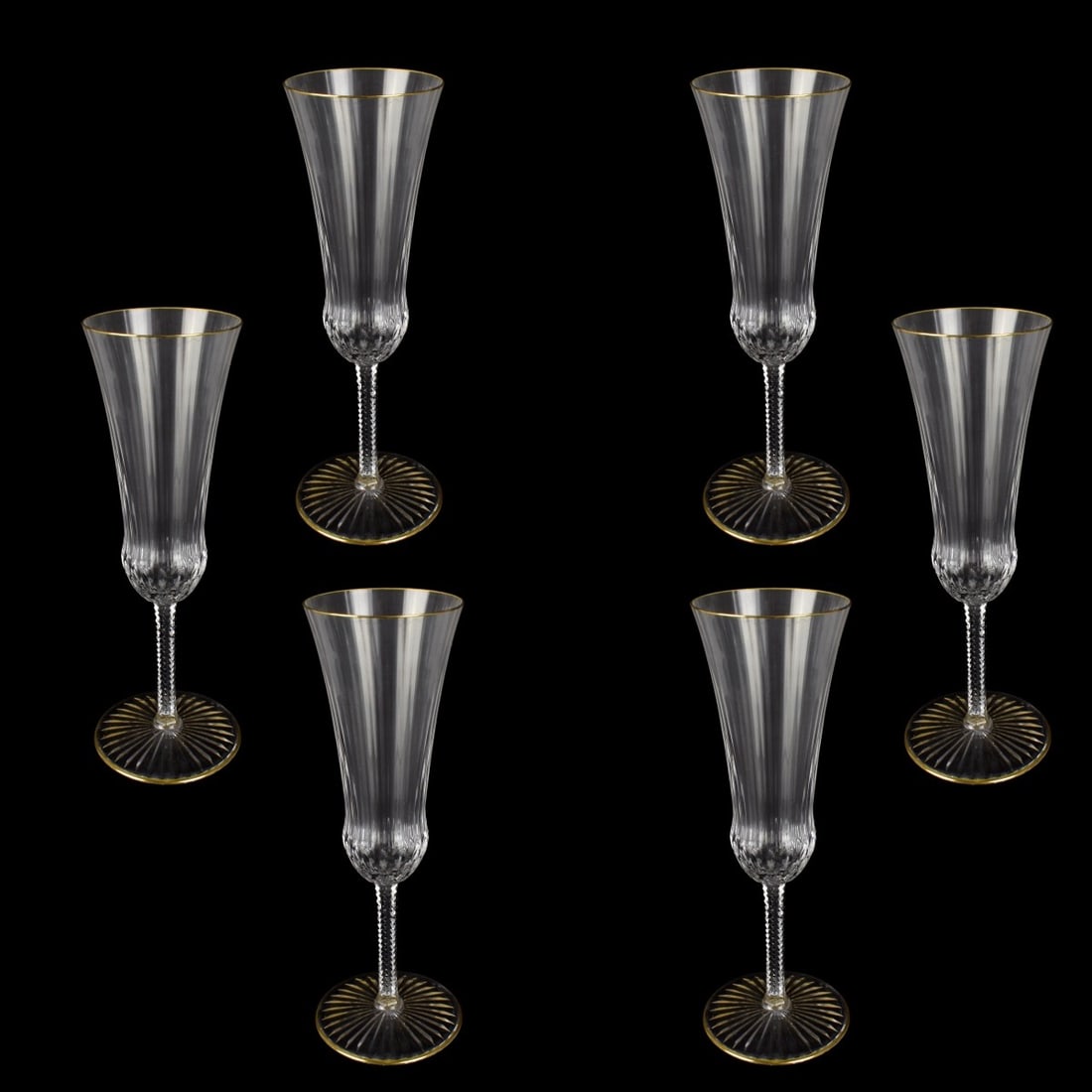 St Louis "Apollo" Wine Stems: Six French St Louis "Apollo" Pattern Crystal Champagne Flutes. Etched mark to base. Measure 7-1/2" H, 2-3/8" W (at rim). Condition: Very good condition. Estimate: $250.00 - $500.00 Domestic Shipping: 